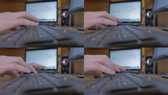 双手在书桌上的黑色键盘上打字高清在线视频素材下载