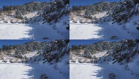 航拍冬天湖北神农架雪景山路行驶的汽车高清在线视频素材下载