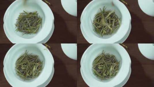 绿茶茶叶下落到盖碗里高清在线视频素材下载