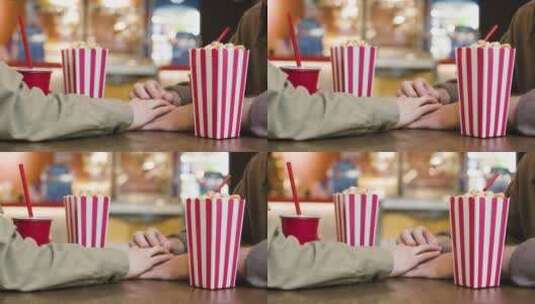 坐在电影院小吃店的情侣高清在线视频素材下载