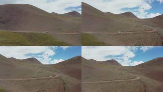 航拍越野车行驶在无人区的山路上高清在线视频素材下载