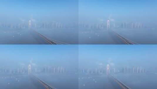 航拍云雾中的清晨杨泗港大桥高清在线视频素材下载