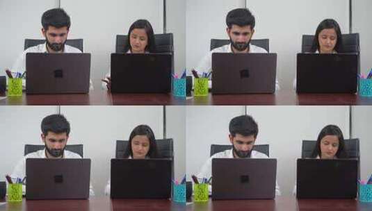 两位员工在电脑前工作高清在线视频素材下载