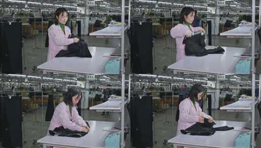 服装厂生产车间女工西裤质量检测高清在线视频素材下载