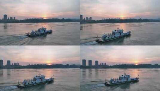 航拍夕阳下长江里航行的小船高清在线视频素材下载