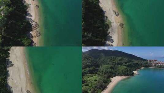 航拍海边碧绿海水和沙滩礁石风光高清在线视频素材下载