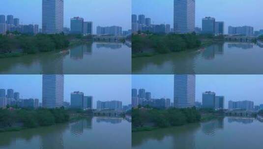 广州南沙城市摩天大楼与蕉门河划龙舟高清在线视频素材下载