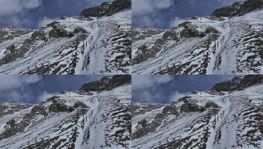 航拍攀登岷山山脉主峰雪宝顶雪山的登山队高清在线视频素材下载