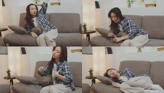 一个生病的女孩躺在沙发上，用温度计测量她高清在线视频素材下载