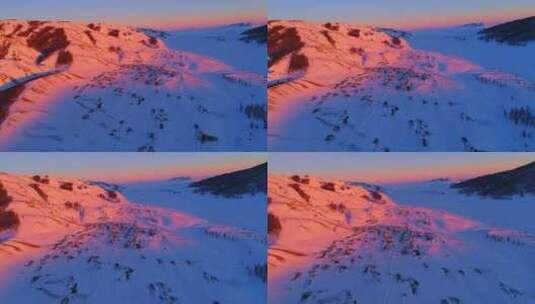 新疆阿勒泰雪山红色夕阳下的村落高清在线视频素材下载