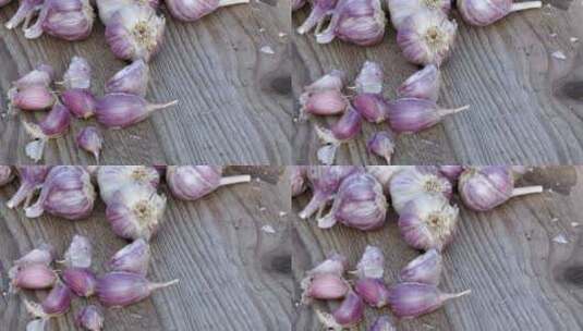 木制复古背景上的大蒜。种植大蒜的幼苗。高清在线视频素材下载
