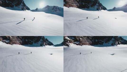 滑野雪的运动员徒步上山高清在线视频素材下载