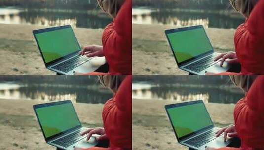 在湖边用笔记本电脑的人高清在线视频素材下载