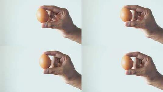 一颗拿在手中的鸡蛋高清在线视频素材下载
