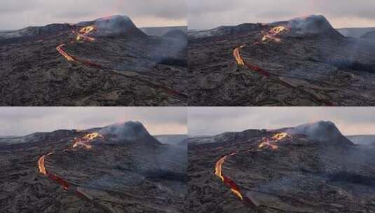 白天喷发时从火山口流出的炽热熔岩。宽空中高清在线视频素材下载