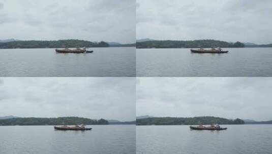 西湖里的手摇船游船高清在线视频素材下载