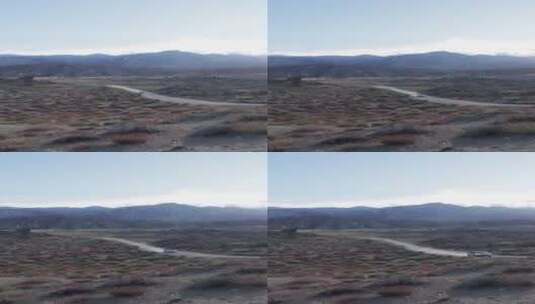 竖屏沙漠道路上行驶的越野车高清在线视频素材下载