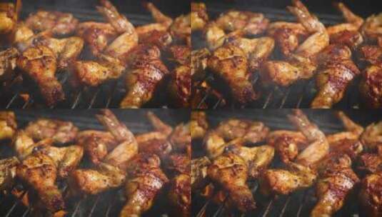 美味的鸡腿和鸡翅在烧烤架上被烤制高清在线视频素材下载