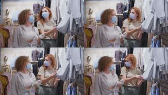 两个女孩在商店里挑选衣服高清在线视频素材下载