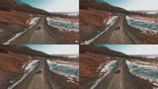 无人家 航拍 雪山 树林 沙土路 汽车高清在线视频素材下载