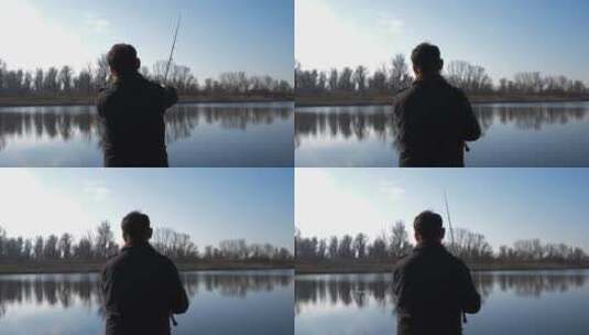 男人站在湖边钓鱼高清在线视频素材下载