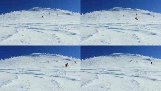 人们在雪山上滑雪高清在线视频素材下载