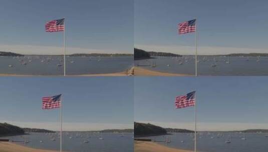 纪念公园的美国国旗空中平底锅和停泊在港口的船只高清在线视频素材下载