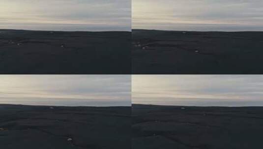 无人机驶向黑沙上的飞机残骸高清在线视频素材下载