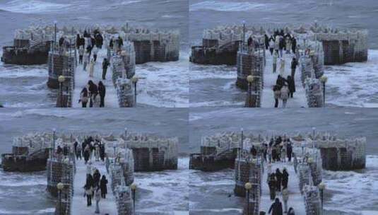 山东威海金海湾栈桥冰河世纪游客海冰海浪高清在线视频素材下载