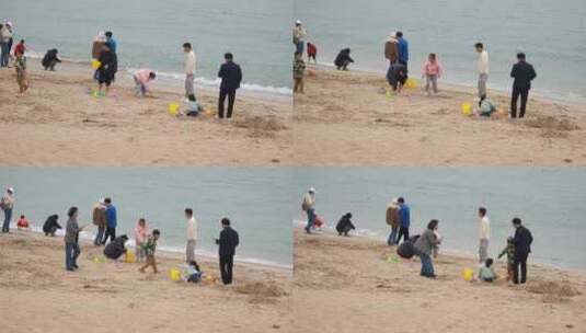 一群旅客在海边沙滩赶海玩耍高清在线视频素材下载