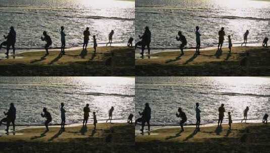 海南三亚黄昏阳光下沙滩度假的人群剪影高清在线视频素材下载
