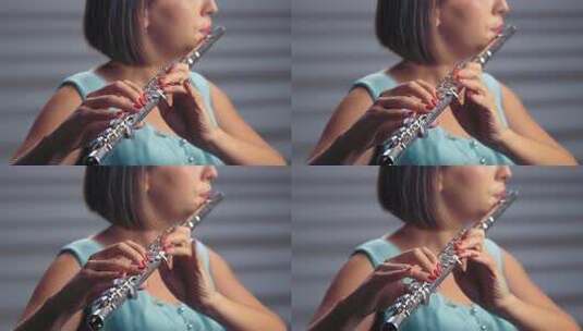 聚光灯下的女音乐家长笛演奏高清在线视频素材下载