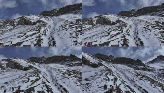 航拍攀登岷山山脉主峰雪宝顶雪山的登山队高清在线视频素材下载