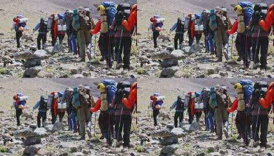 攀登新疆帕米尔高原慕士塔格峰雪山的登山队高清在线视频素材下载
