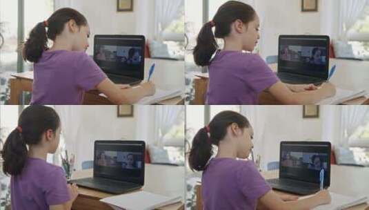 小女孩上网课时认真做笔记高清在线视频素材下载