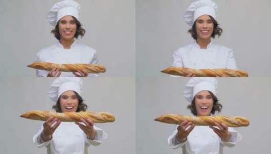 快乐女厨师展示法式面包高清在线视频素材下载
