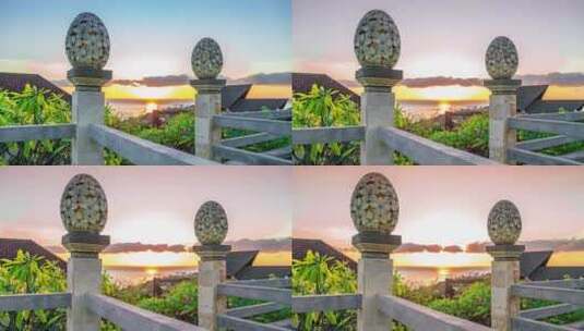 巴厘岛阿梅德海滩日出与海面背景下的灯笼花卉图案雕塑沙石高清在线视频素材下载