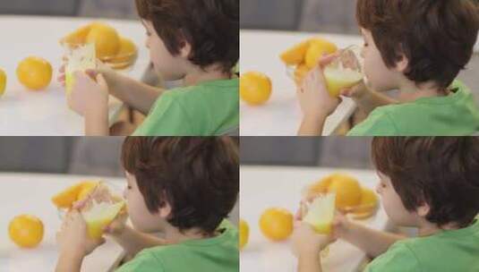品尝健康饮料这张男孩喝橙汁的照片符合营养高清在线视频素材下载