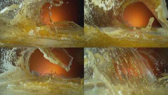啤酒金黄色液体冲击出旋涡高清在线视频素材下载