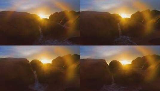 三亚海边日落沙滩岩石海浪高清在线视频素材下载