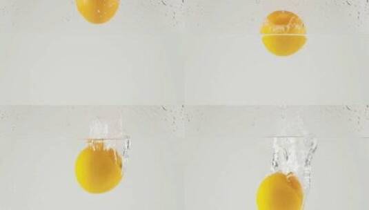 橙子入水瞬间高速摄影高清在线视频素材下载