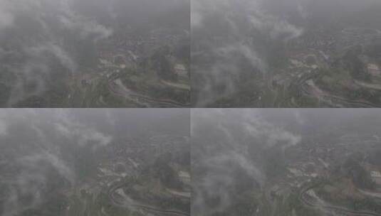 航拍雨中云雾缭绕的湖南十八洞村高清在线视频素材下载