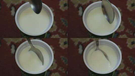 用勺子吃一勺酸奶高清在线视频素材下载