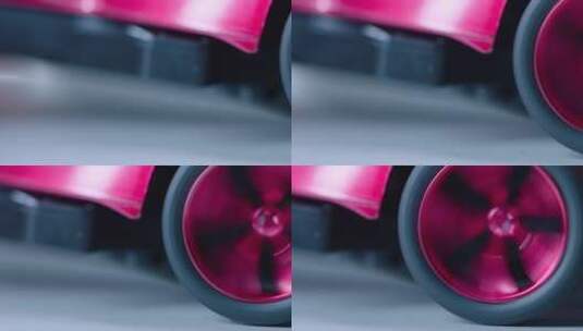红色跑车汽模 后轮旋转特写 车前移到后轮高清在线视频素材下载