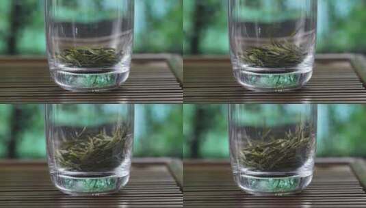 往玻璃杯中放绿茶叶泡茶高清在线视频素材下载