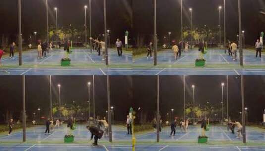 夜晚羽毛球场打羽毛球锻炼的人2高清在线视频素材下载