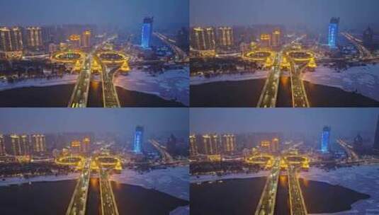 中国黑龙江哈尔滨公路大桥夜晚雪景航拍高清在线视频素材下载