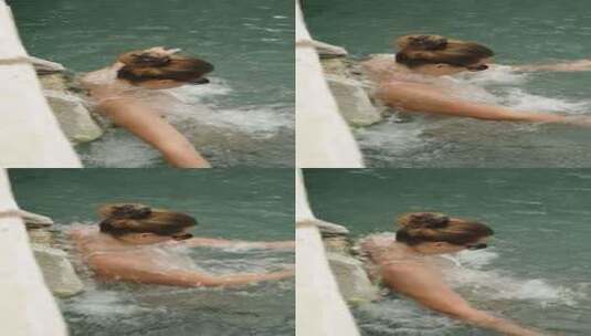 垂直视频。埃及艳后泳池的侧视图，一名年轻高清在线视频素材下载