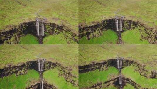 绝美瀑布从悬崖上飞溅的鸟瞰图高清在线视频素材下载