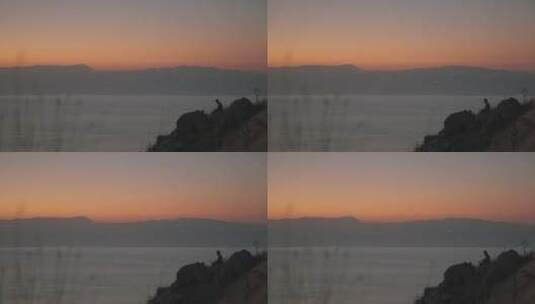 摄影师在拍日落景观高清在线视频素材下载